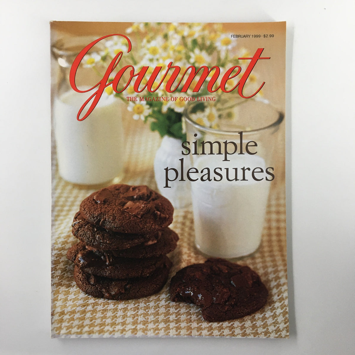 Gourmet Magazine February 1999 cover featuring a stack of warm chocolate cookies next to a glass of cold milk with the title 'A Glass of Cold Milk & Warm Choco Cookie' and the subtitle 'simple pleasures'.