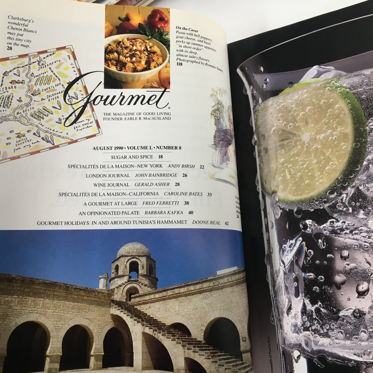 Inside page of Gourmet Magazine August 1990 displaying a table of contents along with an image of a historical site and a close-up of a glass of sparkling water with lime. Highlights features like 'Gourmet Holidays in and Around Tunisia's Hammamet' and various articles related to gourmet cuisine.