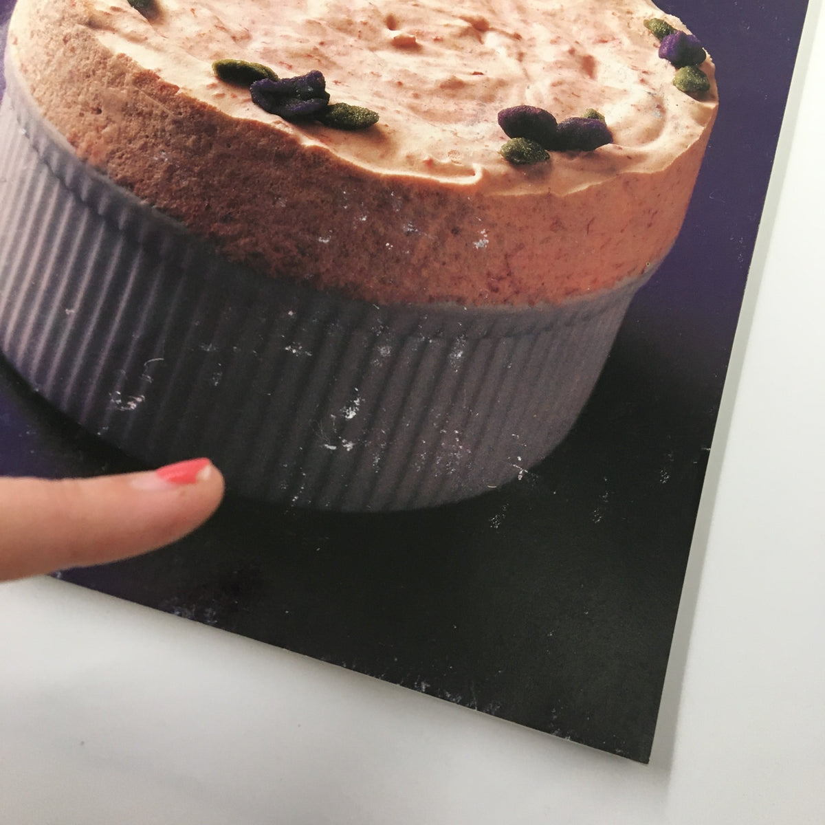 Close-up of the dessert featured on the cover of Gourmet Magazine August 1991, showcasing details of the toppings and serving dish.