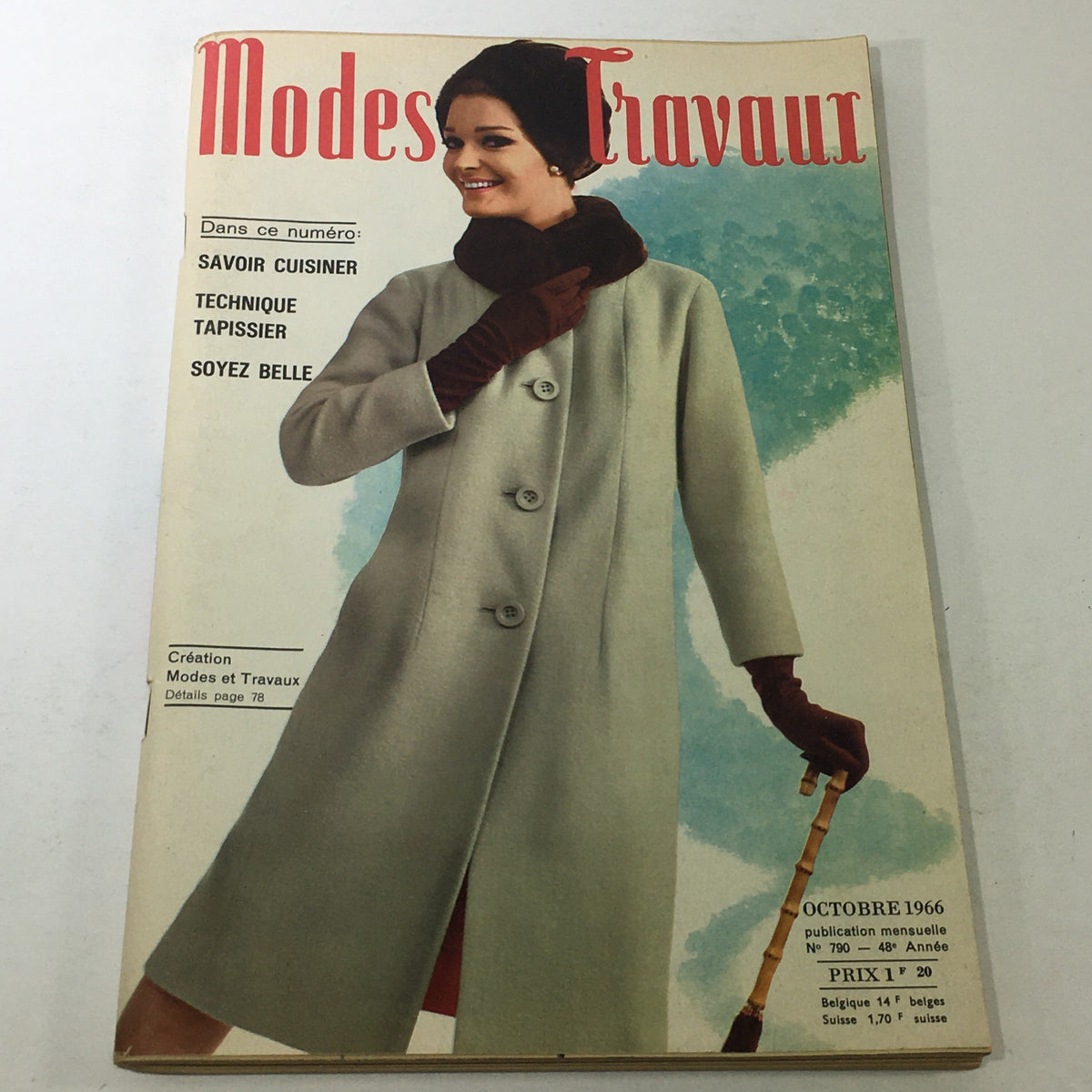 VTG Modes Travaui Catalog: October 1966 cover featuring the stylish model in a grey coat, promoting the 'Soyez Belle' theme. Perfect for vintage fashion collectors.
