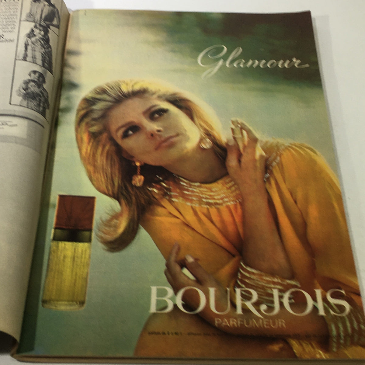 Interior spread of the VTG Modes Travaui Catalog: October 1966, showcasing a glamorous advertisement for Bourjois perfume, illustrating 1960s fashion and beauty trends.