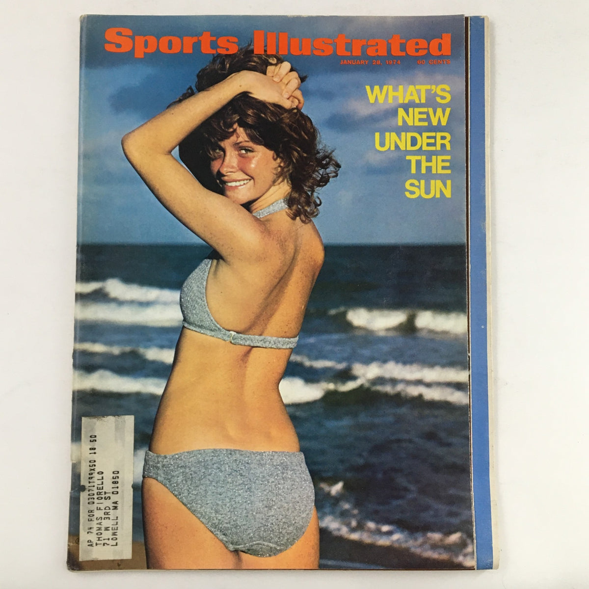 Sports Illustrated Swimsuit Issue Magazine January 28, 1974 featuring Ann Simonton on the cover, showcasing her in a gray bikini on a beach with waves in the background, highlighting the beauty and fashion of the 1970s.
