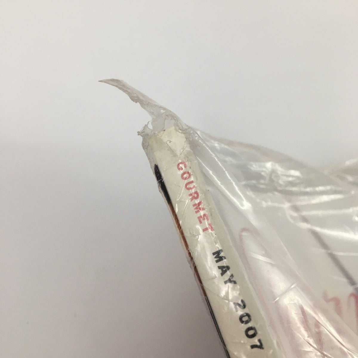 Close-up view of Gourmet Magazine May 2007 spine showing minor wear, illustrating its vintage condition, with the title clearly visible.