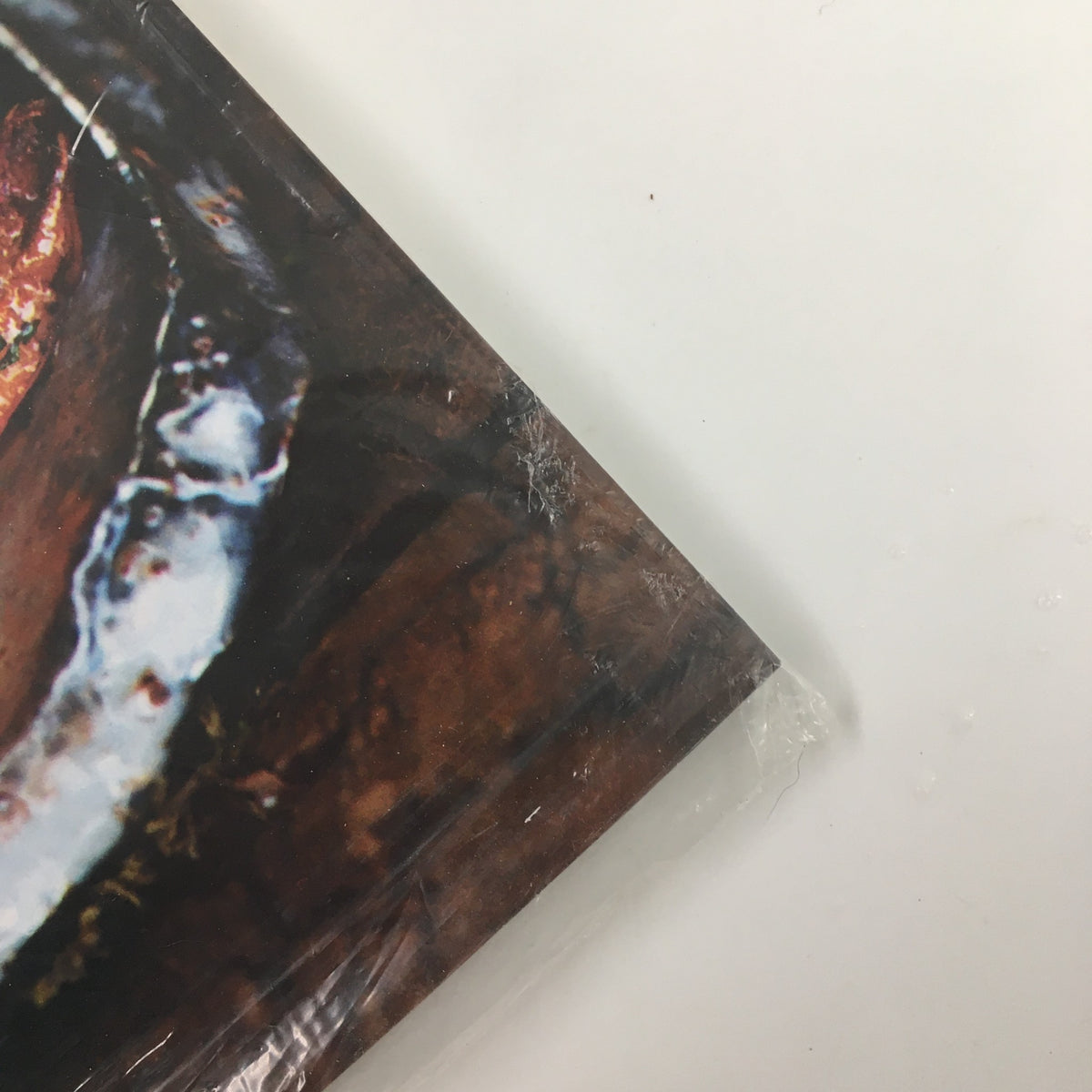 Detailed image of the lower corner of Gourmet Magazine May 2008, showcasing the cover design with artistic food photography, still sealed for collectors.