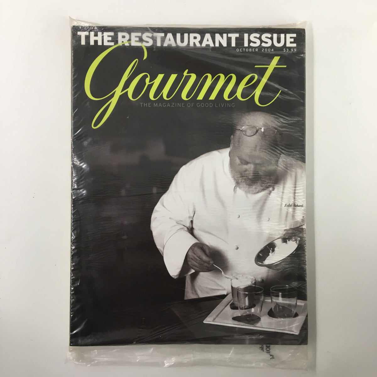 Cover of Gourmet Magazine October 2004 featuring a chef preparing a dish, highlighting the Cider Spice Cake recipe. The magazine is sealed and in original plastic.