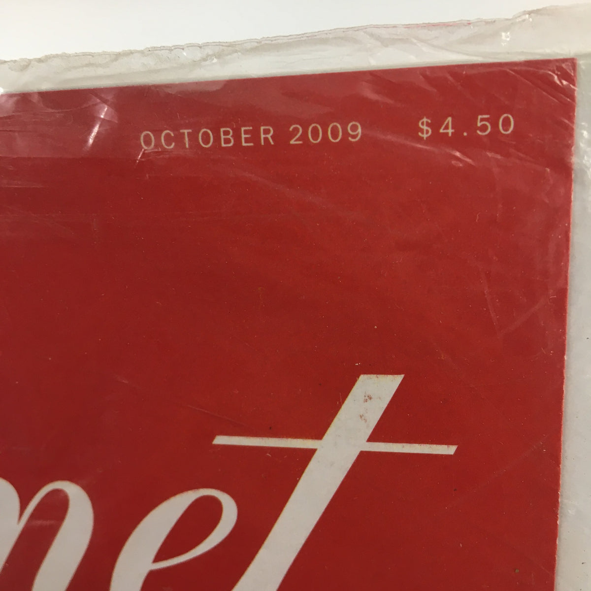 Detail shot of the top of the Gourmet Magazine October 2009 where the date and price are displayed, emphasizing the magazine's collectible nature.