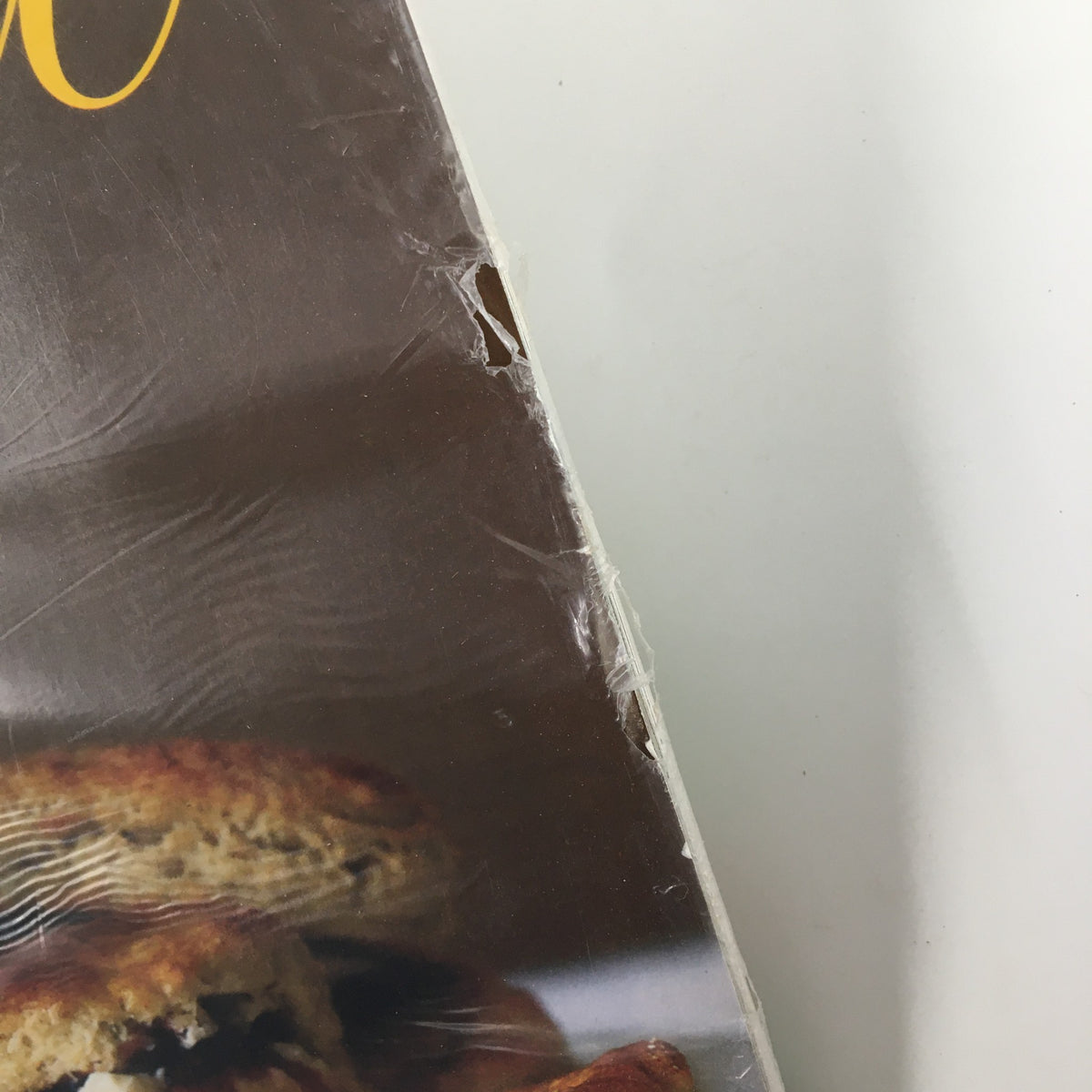 Close-up of Gourmet Magazine January 2008 showing wear on protective plastic covering, emphasizing its collectible value.