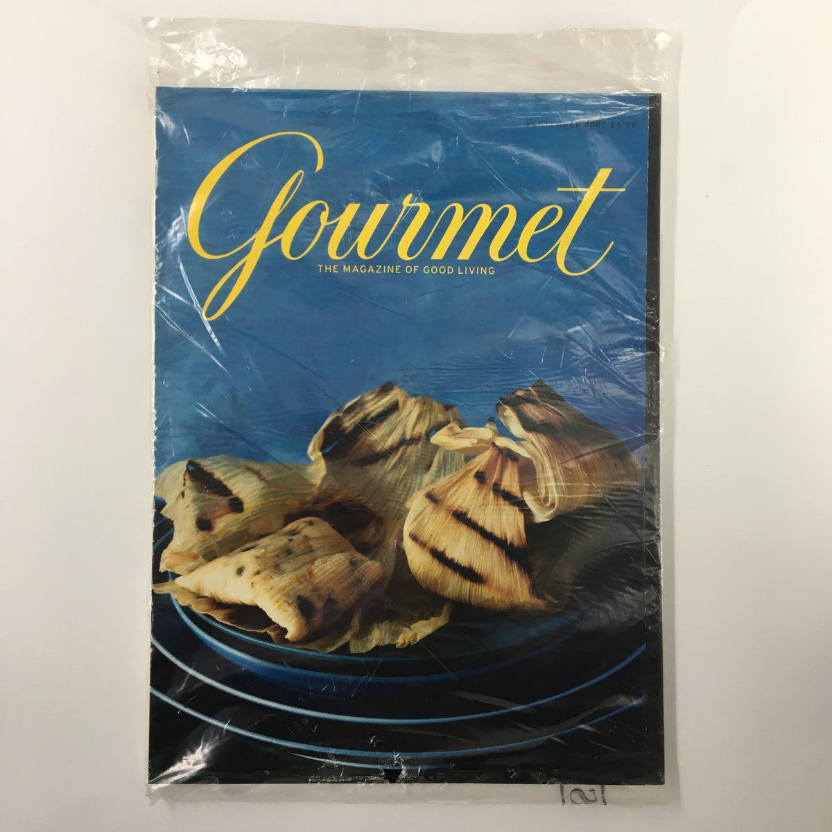 Gourmet Magazine September 2007 issue featuring a vibrant cover with a plate of grilled food, sealed in plastic wrapping, showcasing Salvadoran cuisine in Los Angeles.