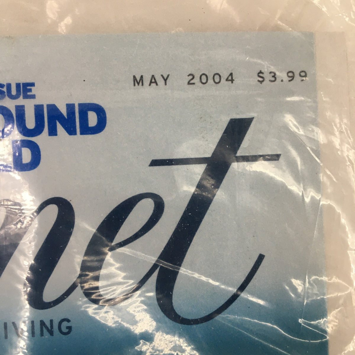 Close-up of the May 2004 date and price on the cover of Gourmet Magazine, sealed and highlighting the edition's collectible nature.