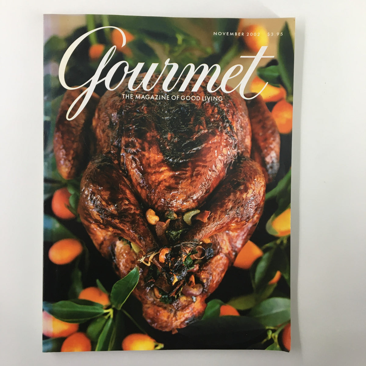 Cover of Gourmet Magazine November 2002 titled 'The Peaceable Feast Thanksgiving Meal' featuring a beautifully roasted turkey surrounded by seasonal garnishes.