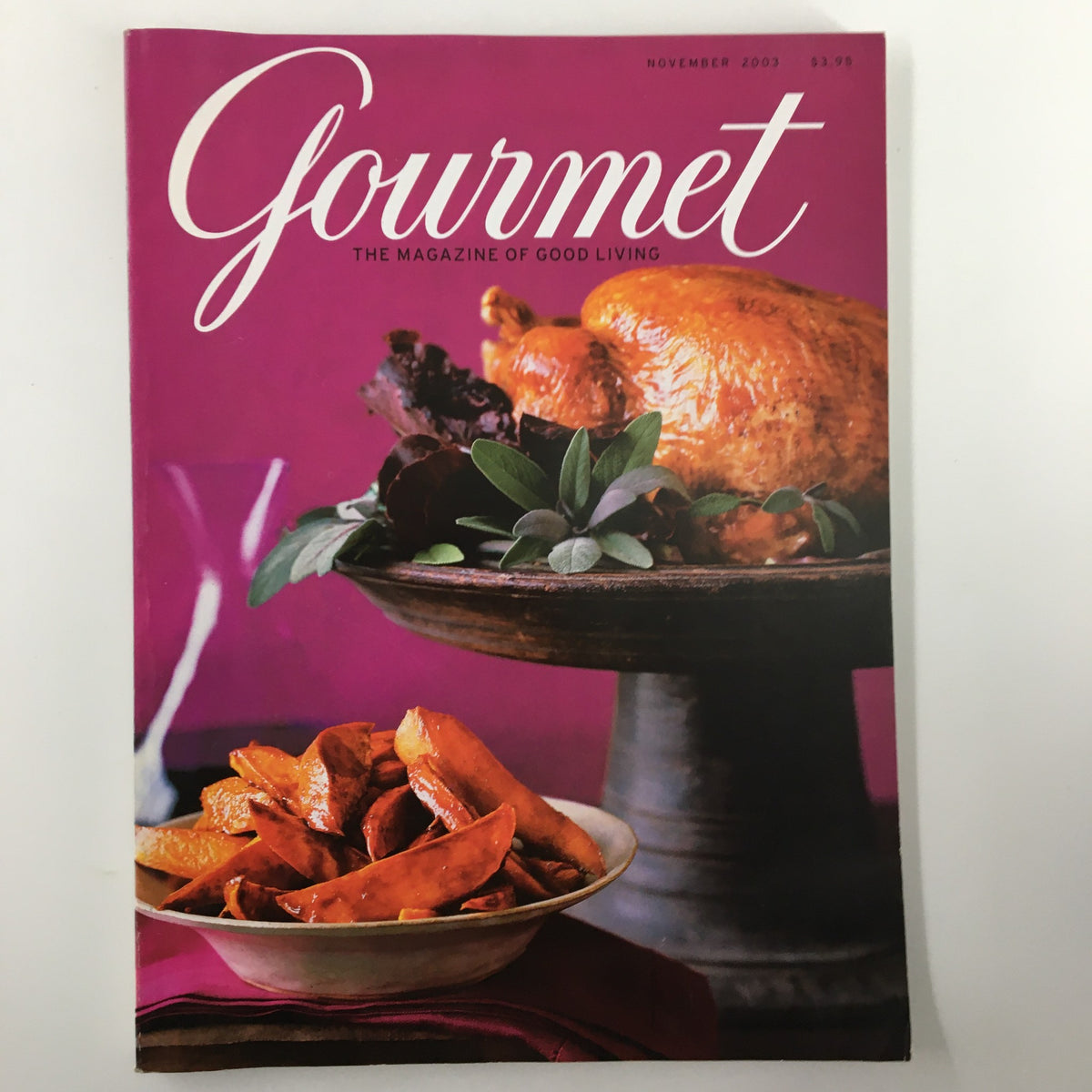 Cover of Gourmet Magazine November 2003 featuring a beautifully roasted turkey and savory side dishes that embody Thanksgiving celebrations.