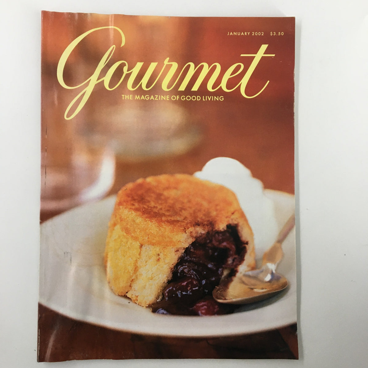 Cover of Gourmet Magazine January 2002 featuring a delicious dessert, showcasing culinary artistry related to the article 'Stoning The Mangoes'.