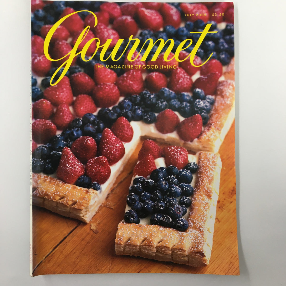 Cover of Gourmet Magazine July 2002 featuring a vibrant dessert topped with fresh raspberries and blueberries, highlighting 'The Art of Cool in the Western Sky'.
