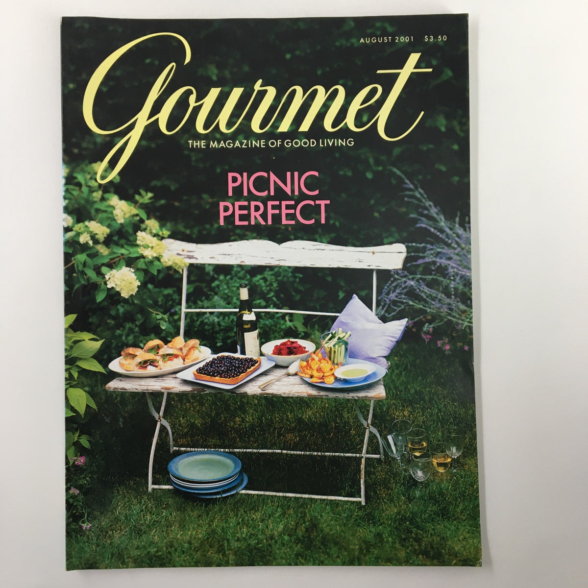 Gourmet Magazine August 2001 cover featuring a picnic setup, highlighting 'Picnic Perfect' theme, showcasing a table filled with food, drinks, and tableware.