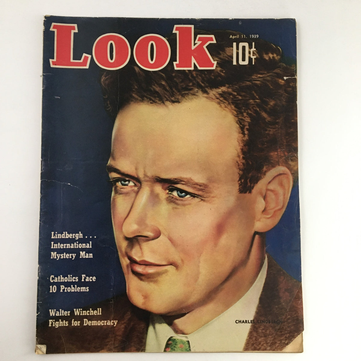 Cover of Look Magazine April 11 1939 featuring Charles Lindbergh as the International Mystery Man, showcasing vintage illustrations and historical context.