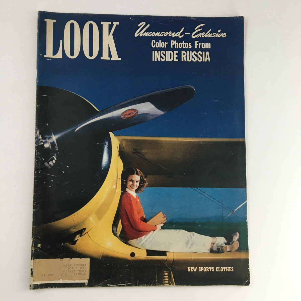 Cover of Look Magazine from May 6, 1941, featuring uncensored and exclusive color photos from inside Russia, showcasing a vintage design with a smiling girl in a red sweater sitting in an aircraft.