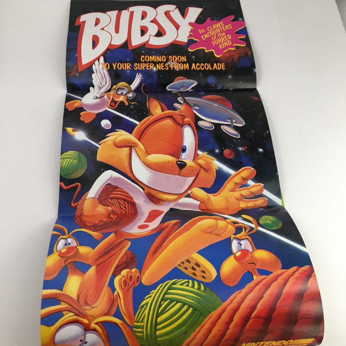 Bubsy video game promotional poster featuring the character Bubsy with colorful graphics in outer space, announcing its upcoming release for the Super NES. Part of the vintage Nintendo Power Magazine May 1993 Vol 48 issue focused on Batman Returns.