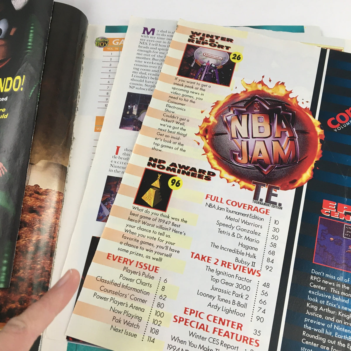 Close-up of Nintendo Power Magazine March 1995 Vol 70 showing contents including NBA Jam T.E. and game review sections.