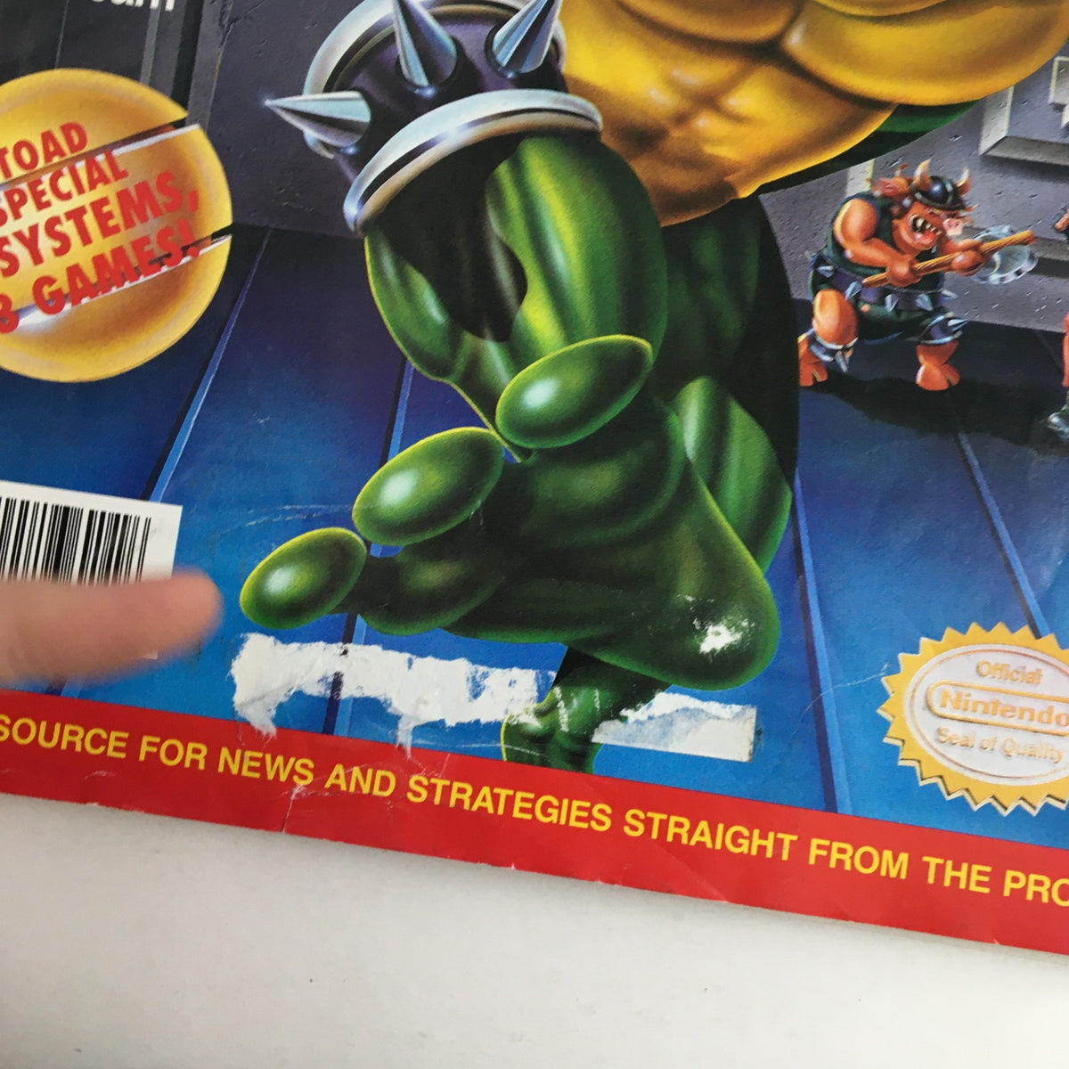 Close-up of the cover of Nintendo Power Magazine June 1993 Vol 49, highlighting details including the character Battletoad and magazine seal.