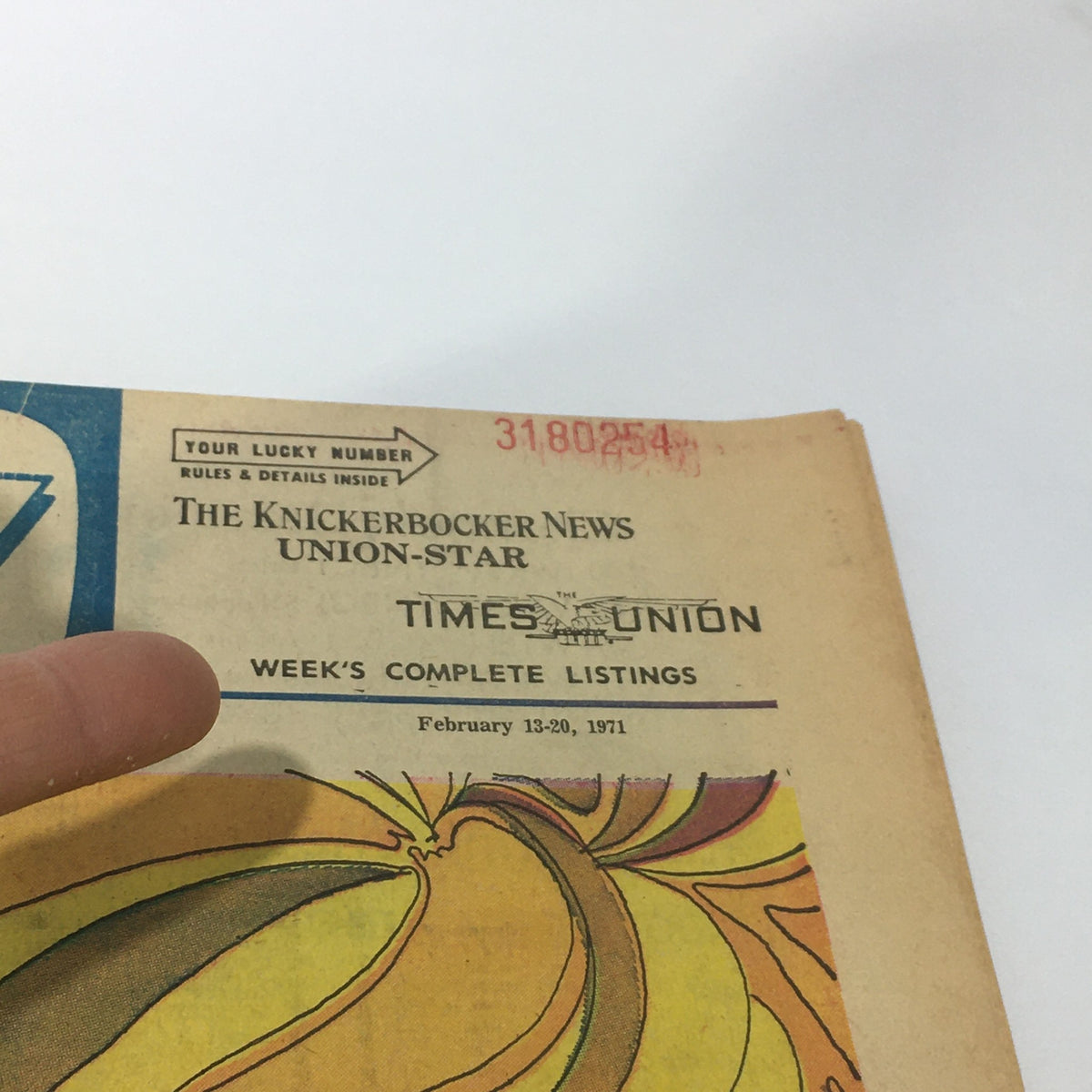 Top view of the VTG TV Week's Complete Listings for February 13-20, 1971, highlighting the magazine's title and 'Pure Goldie' reference against a vintage design backdrop.