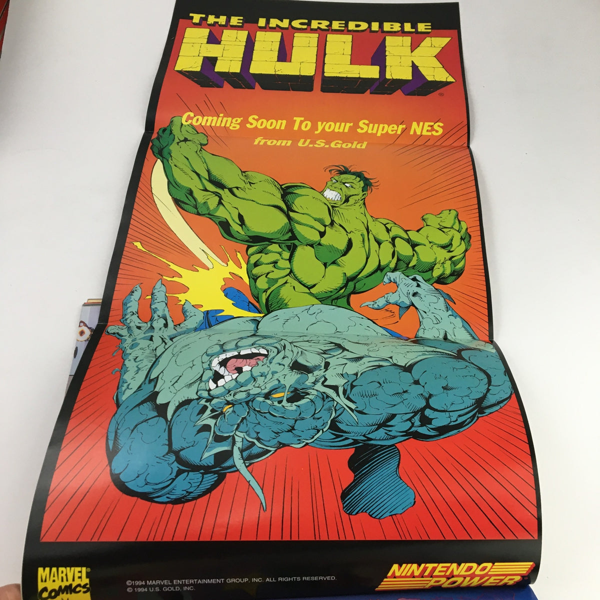 Poster from Nintendo Power Magazine August 1994 Vol 63 featuring The Incredible Hulk, promoting the upcoming Super NES game by U.S. Gold, with vibrant comic art.