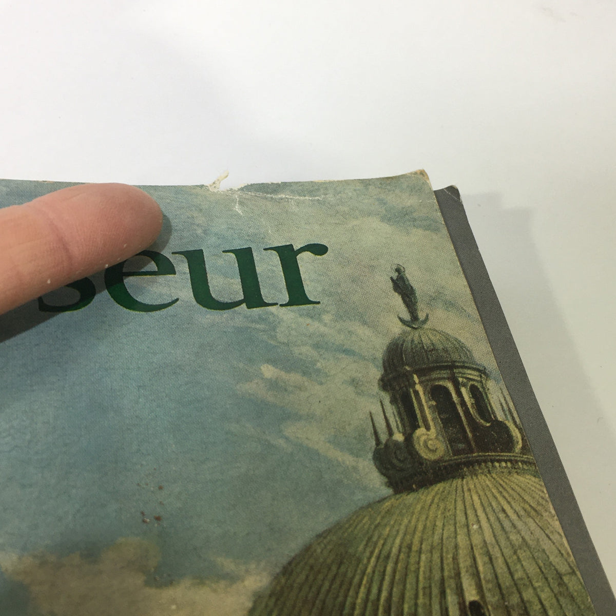 Detail of the cover of the VTG The Connoisseur Magazine May 1963 Vol. 153 No. 615, highlighting some wear and tear, alongside vibrant imagery. This issue captures the essence of the 1960s with insightful articles.
