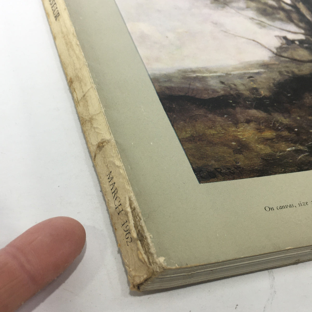 Close-up of the March 1962 spine of The Connoisseur Magazine, highlighting wear and vintage authenticity related to Camille Corot.