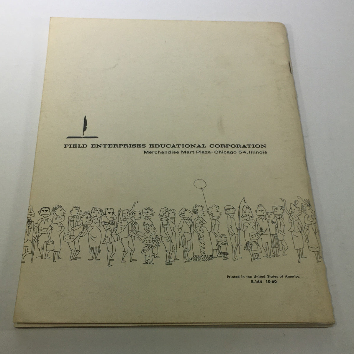 Back cover of the VTG Official United States Population Figures: 1961 - 1960 Census featuring the logo of Field Enterprises Educational Corporation and a cartoon illustration of people, representing the educational focus of the publication.
