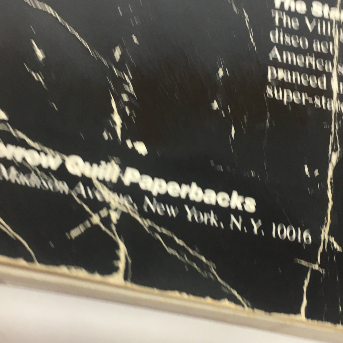 Close-up of the Morrow Quill Paperbacks publisher logo on the back cover of the VTG Dancing Disco Charts Guide Catalog: 1979 by WGBH Educational Foundation.