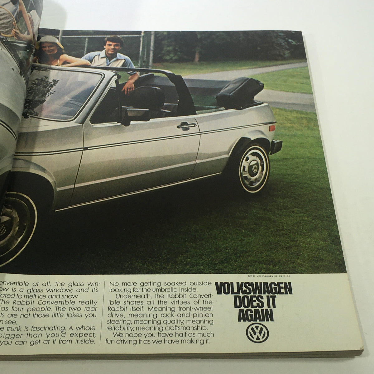 Interior page of VTG Geo Magazine: April 1980 showcasing a Volkswagen Rabbit Convertible with people smiling beside it. The advertisement highlights the car's features and design.