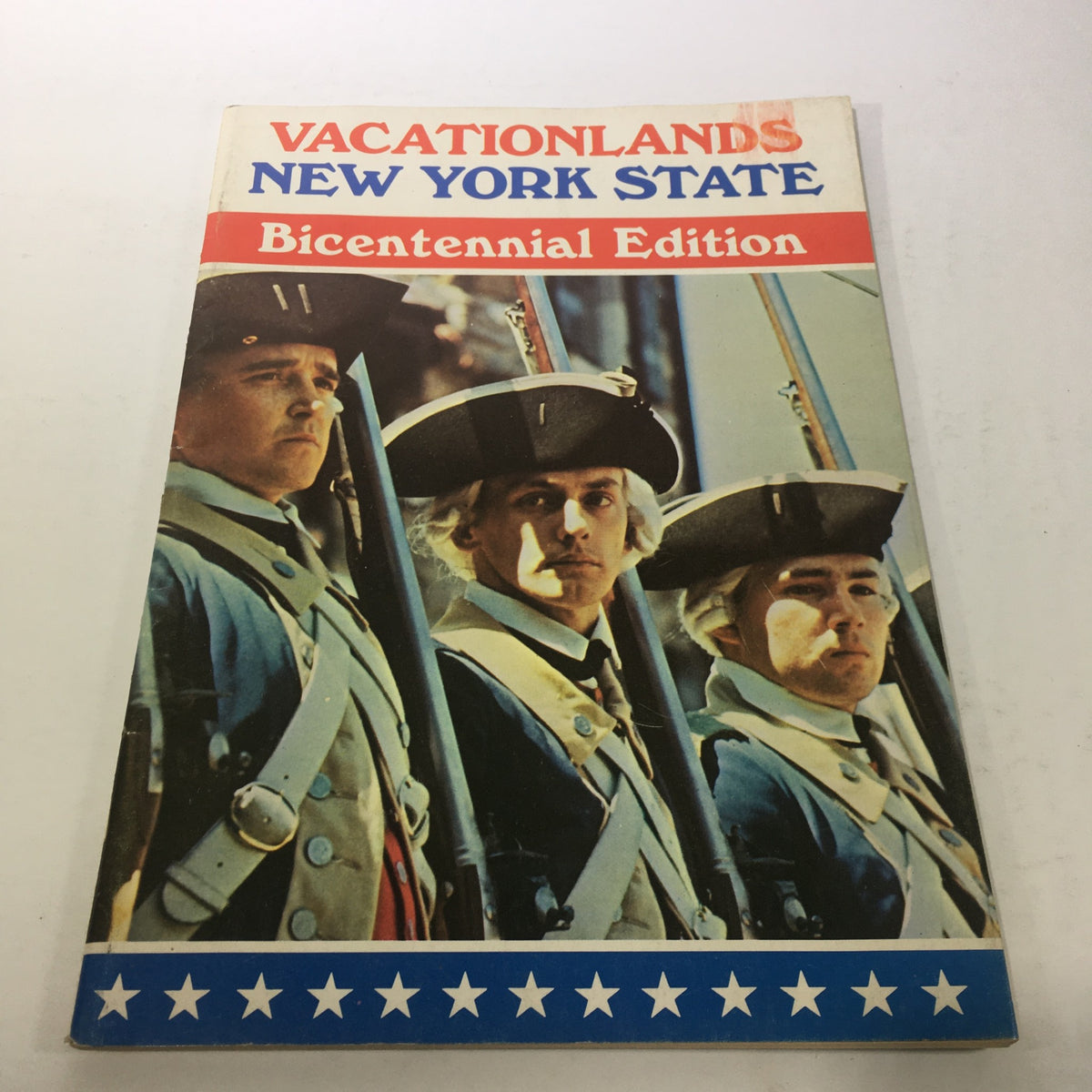 Cover of VTG Vacationlands New York State Bicentennial Edition 1976 featuring historical figures in traditional clothing and a patriotic color scheme.