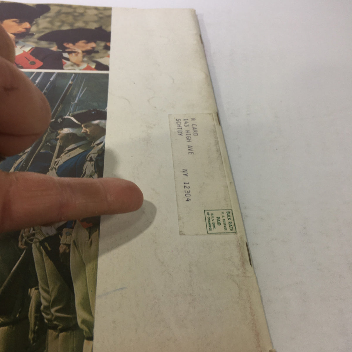 Close-up of an address label on the back cover of VTG Vacationlands New York State Bicentennial Edition 1976, indicating a previous owner.