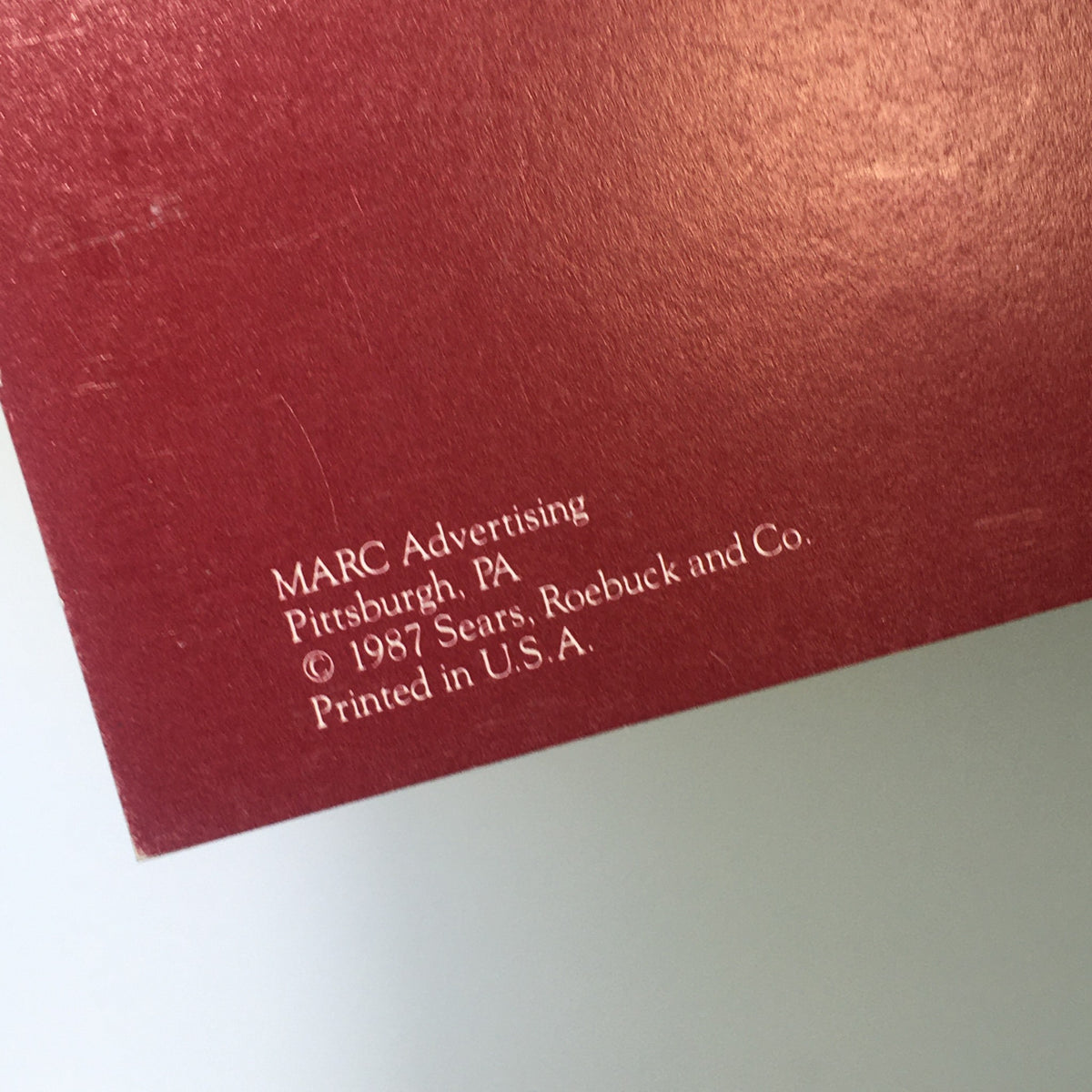 Detail on the back of the VTG Sears 1988 Classic Calendar Consumer Guide showing MARC Advertising credits and copyright information from 1987, printed in the USA.