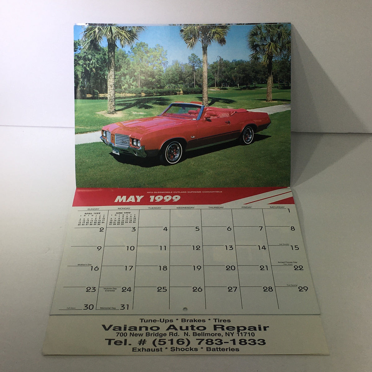 Vintage 1999 Great American Cars Vaiano Auto Repair Calendar page for May 1999 showcasing a 1972 Oldsmobile Cutlass Supreme Convertible parked on a lush green lawn.