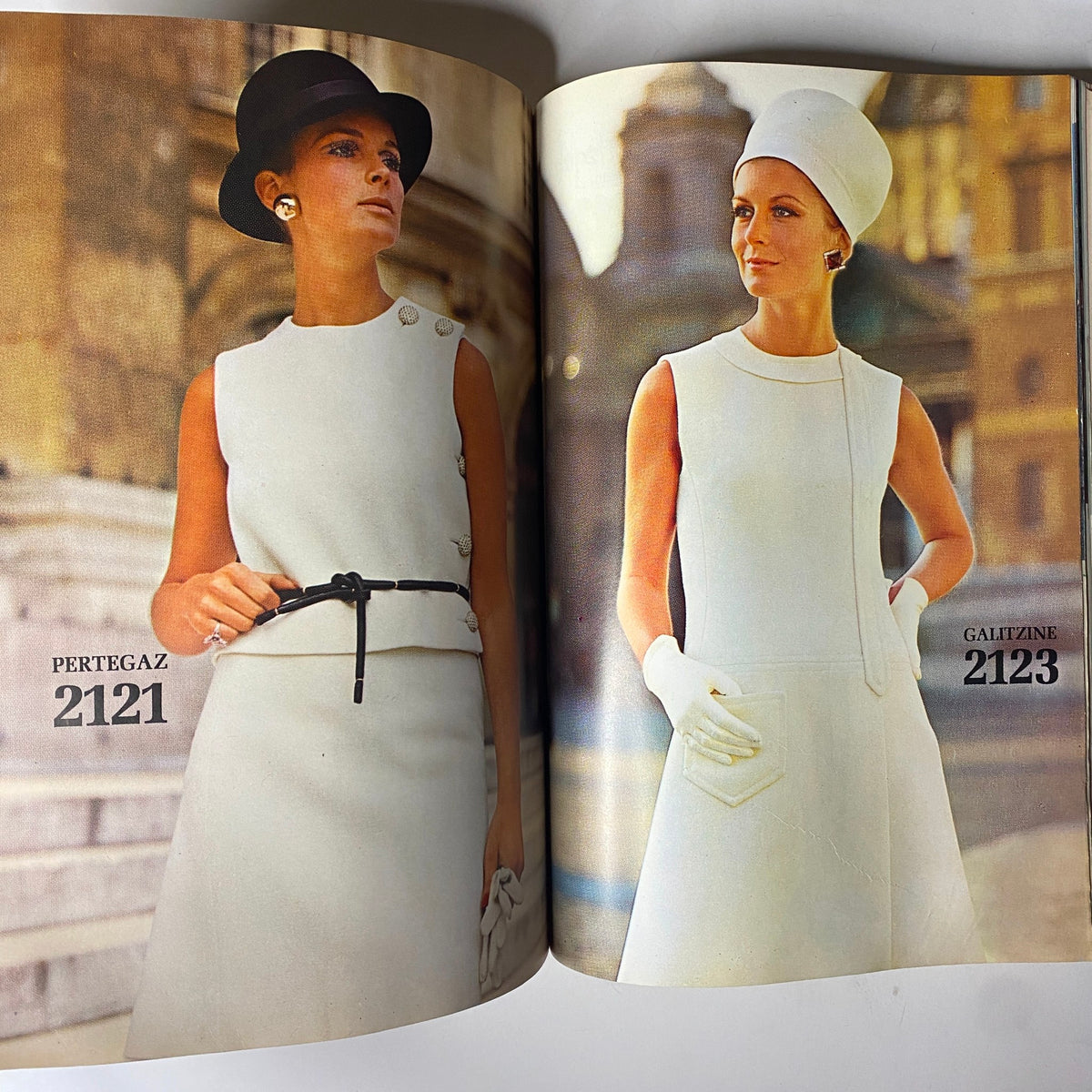 1969 Vogue Patterns July Catalog showcasing Pertegaz design 2121 and Galitzine design 2123, featuring models in elegant white dresses with accessories.
