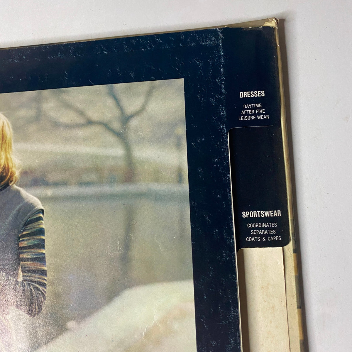 Back cover of the 1972 Vogue Patterns September Catalog displaying the catalog's section titles for dresses and sportswear, enhancing its appeal to vintage fashion enthusiasts.