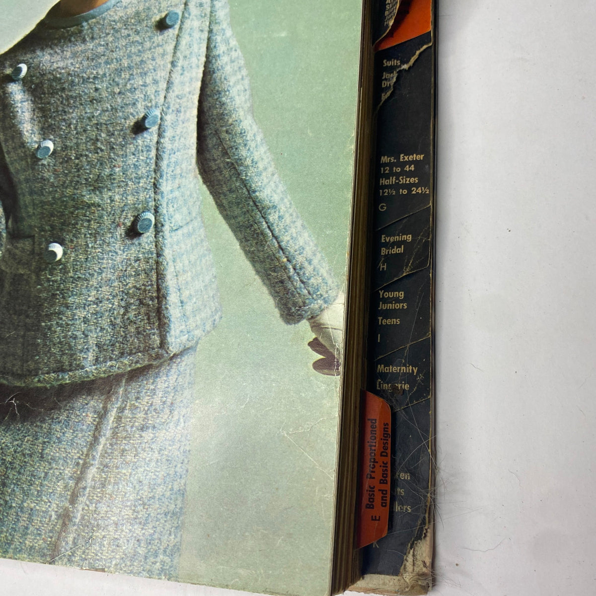 Close-up of the blue wool suit from the 1966 Vogue Patterns April Catalog, detailing the stylish design elements.