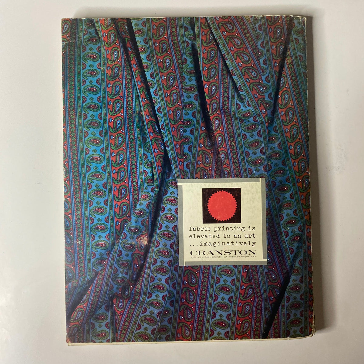 1964 American Fabrics No. 63 Winter & Spring Catalog cover featuring an artistic design with intricate patterns and textures, emphasizing the importance of fabric printing in fashion.