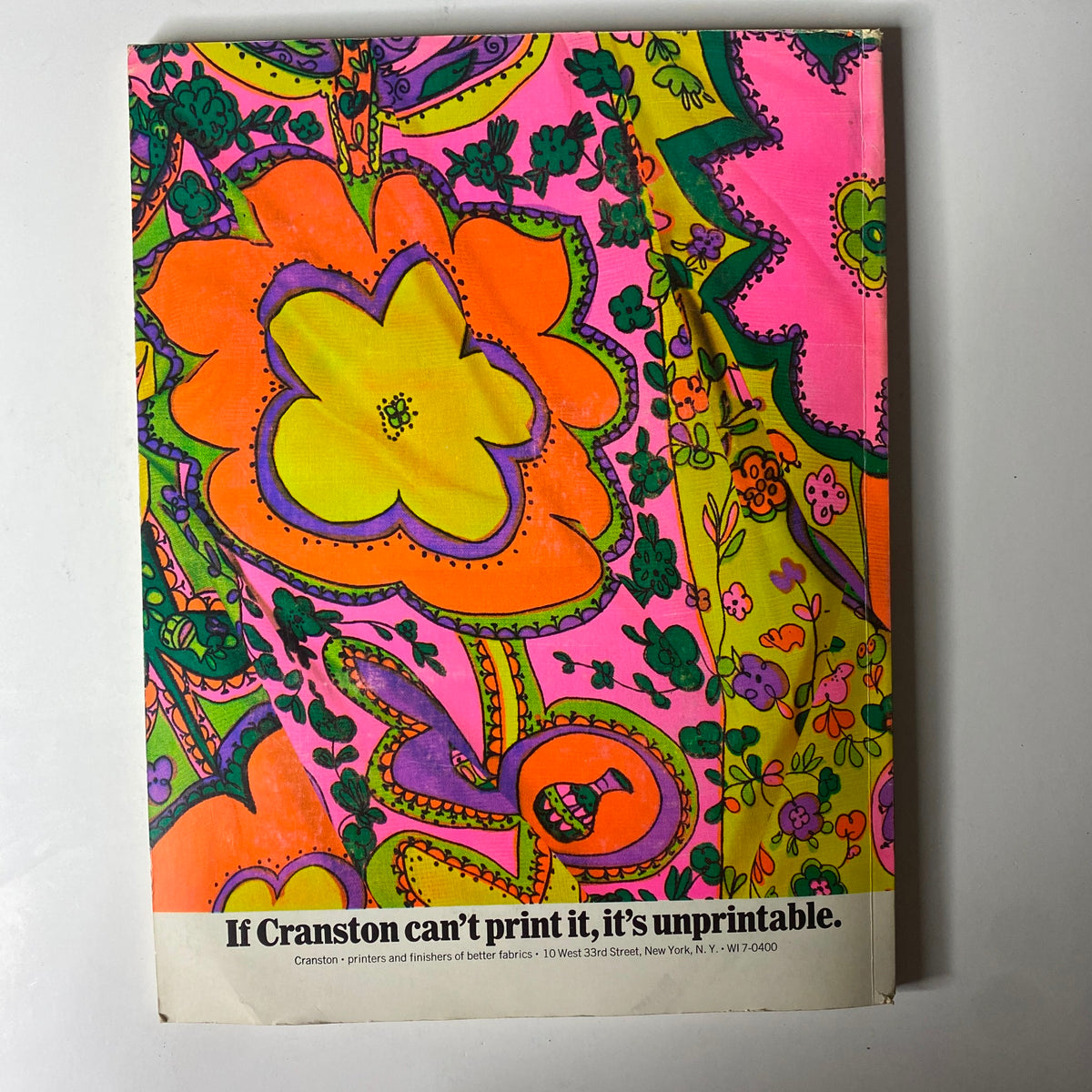 1965 American Fabrics No. 69 Fall Catalog cover displaying vibrant, intricate floral patterns in pink and orange, promoting Cranston's printing services for better fabrics.