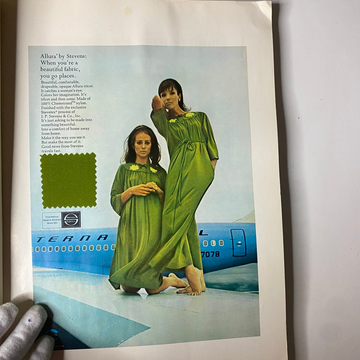 Fashion advertisement page from the 1966 American Fabrics No. 73 Fall-Winter Catalog displaying models in green Allura fabric dresses, highlighting modern textile appeal.