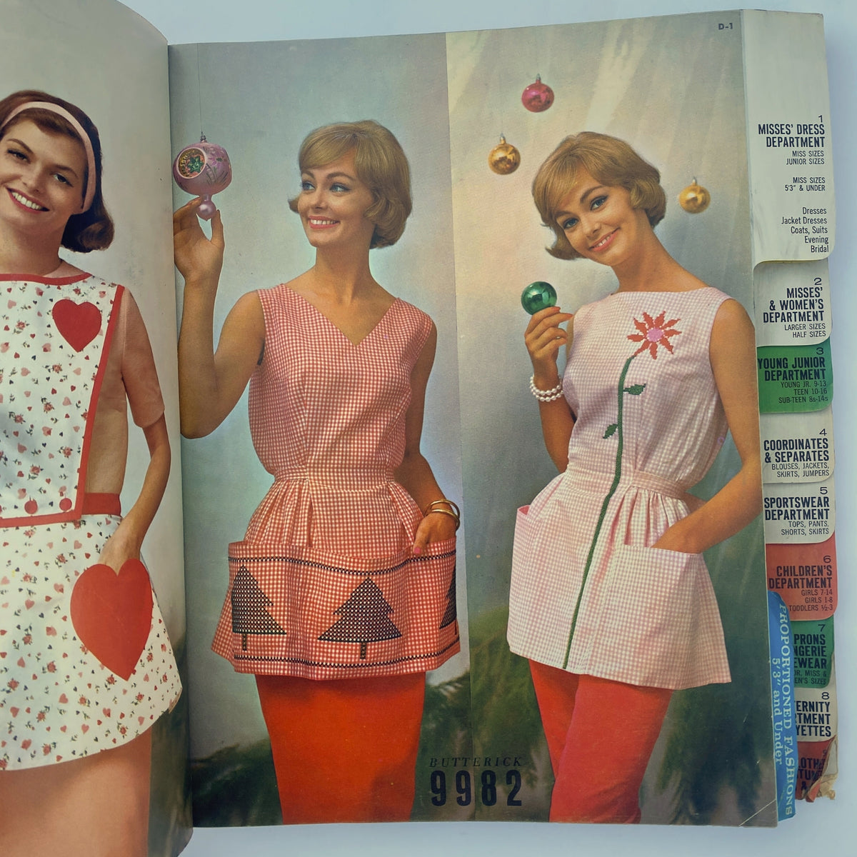 1961 December Butterick Holiday Catalog featuring a model in a stylish pink gingham dress with tree motifs, holding a Christmas ornament, showcasing festive fashion patterns.