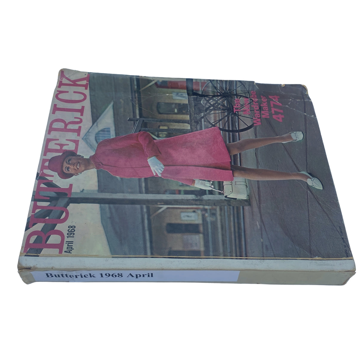 Spine view of the 1968 April Butterick Catalog, highlighting the title and image of a model in a pink outfit.