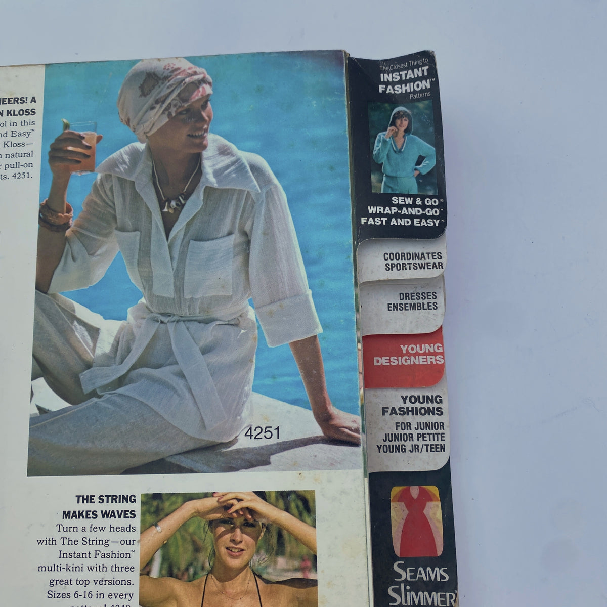 Detail from the 1975 July Butterick Summer Catalog showcasing a model in a stylish beach outfit with a relaxed vibe, promoting the 'Instant Fashion' patterns.