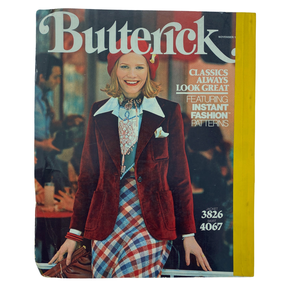 Cover of the 1975 November Butterick Catalog featuring a fashionable model in a velvet blazer and plaid skirt, showcasing classic patterns for fall garments. Highlights include jacket patterns 3826 and skirt patterns 4067, emphasizing seasonal fashion styles.