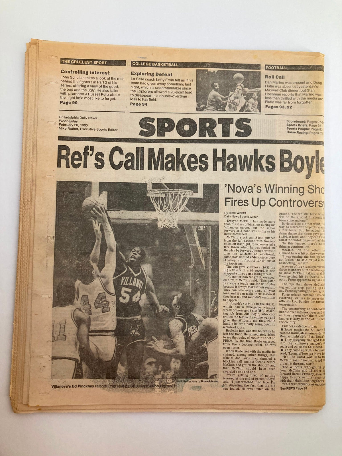 Philadelphia Daily News Tabloid February 20 1985 with a sports article titled 'Ref's Call Makes Hawks Boyle,' showcasing a basketball game moment, highlighting Villanova's winning shot and associated controversy.