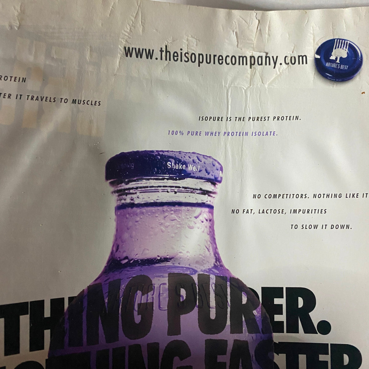 Advertisement for Isopure protein featuring a bottle and text promoting its purity, from Muscle & Fitness Magazine December 2008.