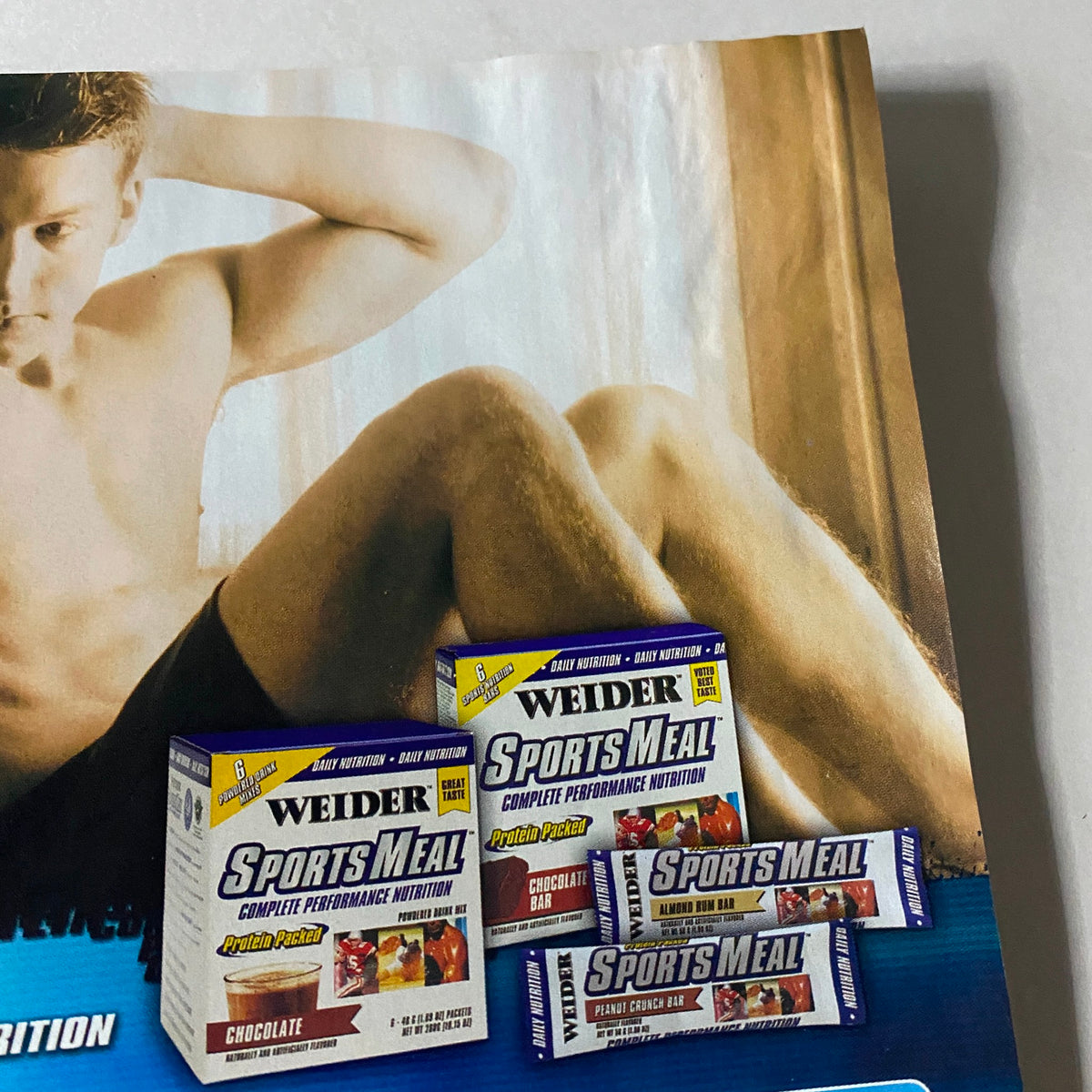 Interior page of Muscle & Fitness Magazine December 2002 showing an advertisement for Weider Sports Meal products, emphasizing fitness nutrition.