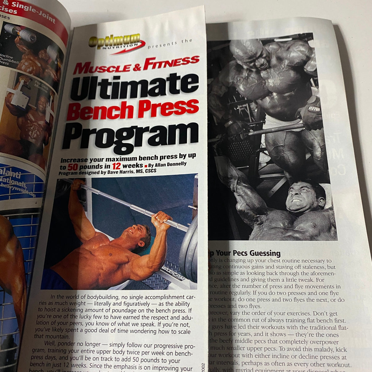 Muscle & Fitness Magazine August 2002 featuring the Ultimate Bench Press Program guide, showcasing a bodybuilder demonstrating proper form in a workout routine.
