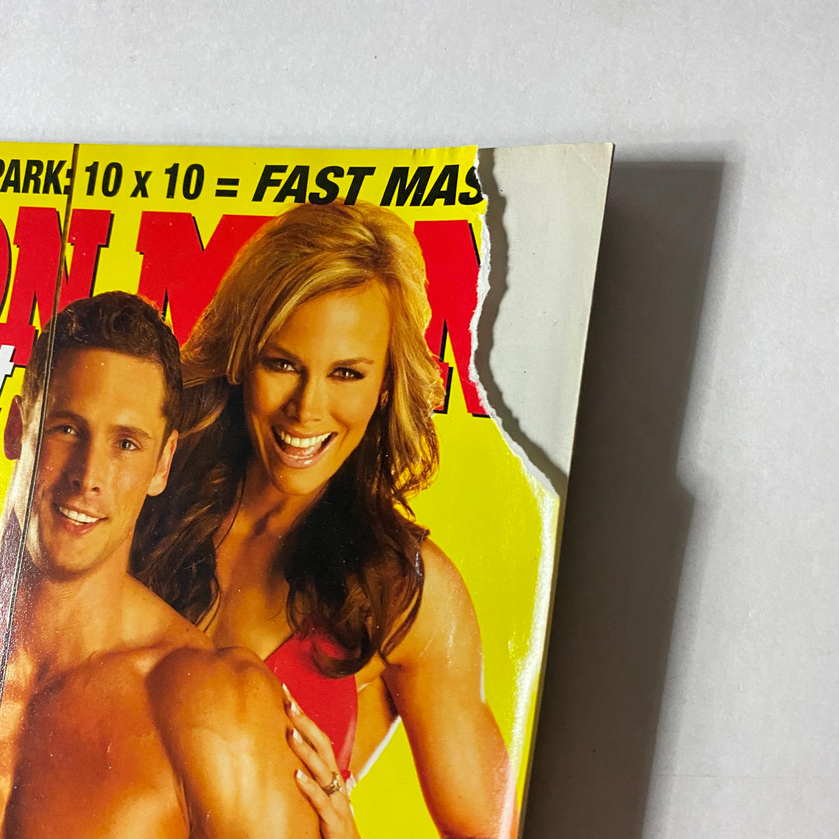Close-up of the Iron Man Magazine June 2009 cover highlighting the wear on the edge while featuring Sean Harley and Allison Eithier.