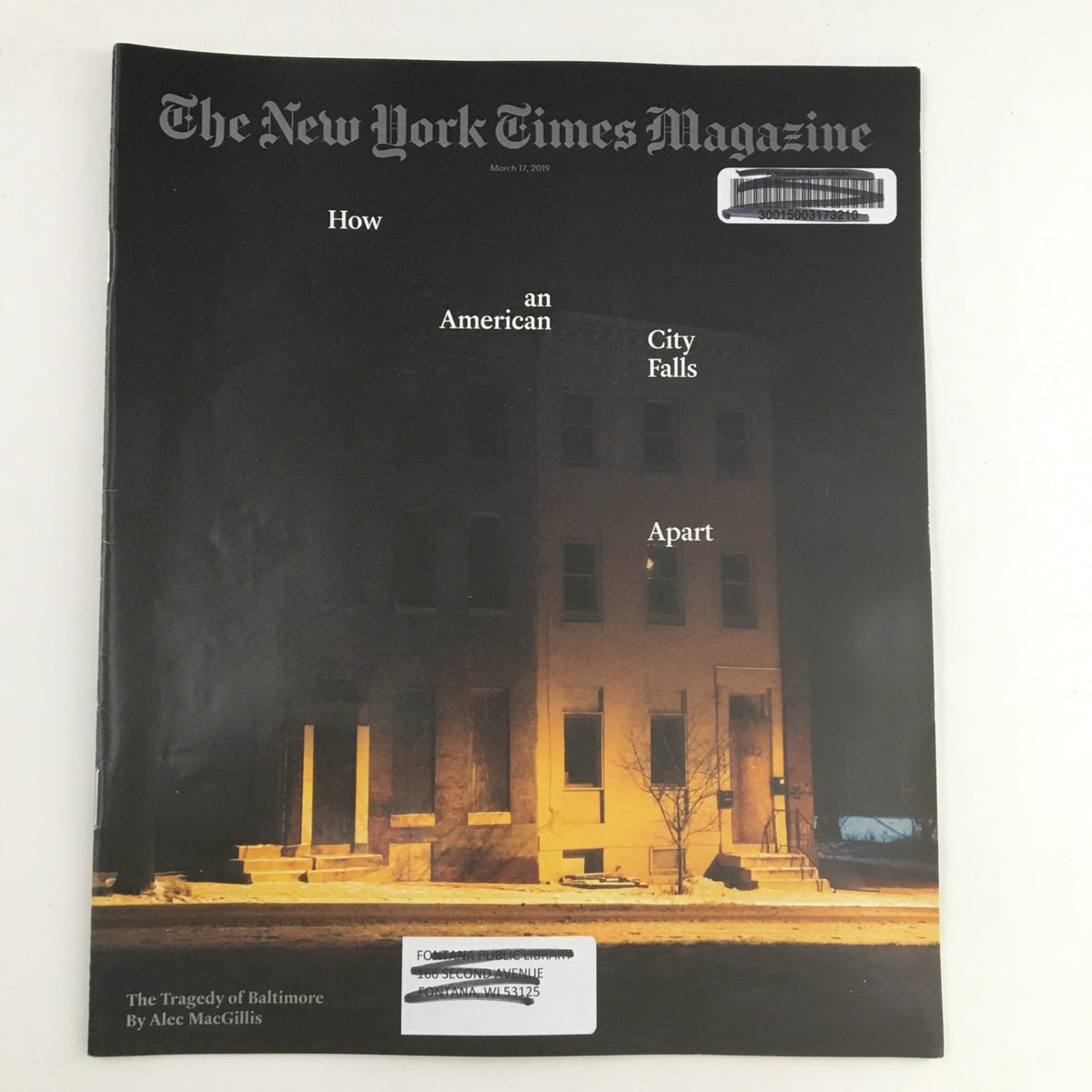 Cover of The New York Times Magazine from March 17, 2019, featuring the title 'The Tragedy of Baltimore' and a striking image of a building at night, highlighting themes of urban decline and socio-political issues.